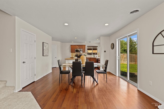 11422 W Darkwood St, Star, ID 83669 - dining room featuring wood finished floors, recessed lighting, and baseboards