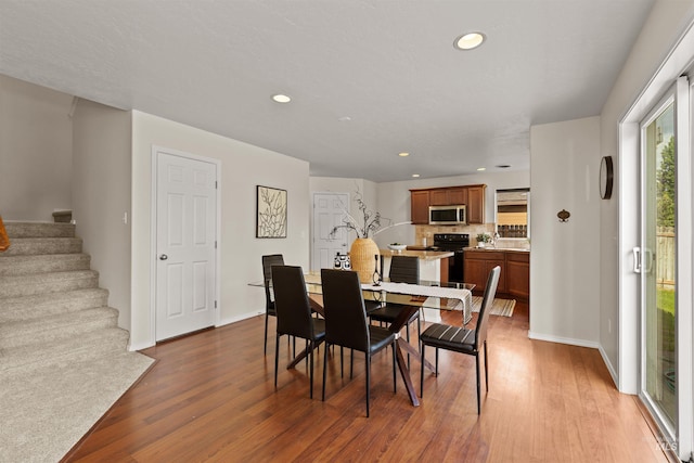 11422 W Darkwood St, Star, ID 83669 - dining space with wood finished floors, stairway, recessed lighting, and baseboards