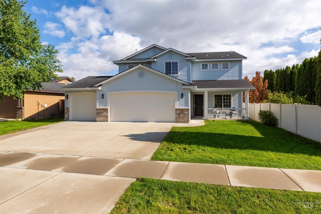 11422 W Darkwood St, Star, ID 83669 - view of front of home with an attached garage, a porch, concrete driveway, and brick siding