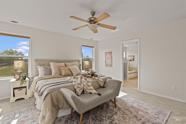 11422 W Darkwood St, Star, ID 83669 - bedroom with light carpet, baseboards, a ceiling fan, and connected bathroom