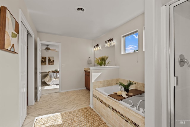 11422 W Darkwood St, Star, ID 83669 - full bathroom featuring vanity, a garden tub, and a ceiling fan