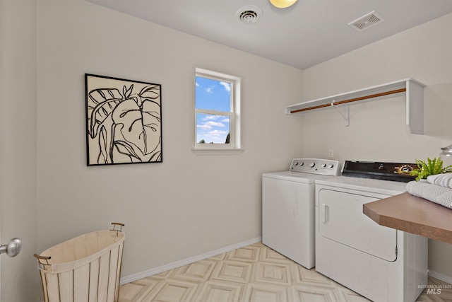 11422 W Darkwood St, Star, ID 83669 - laundry room featuring washer and dryer, baseboards, and light floors