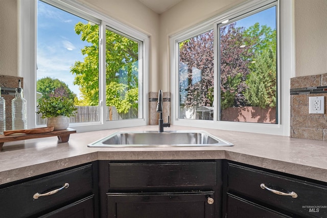 5217 Weston Ave, Caldwell, ID 83607 - kitchen featuring a sink and dark cabinetry