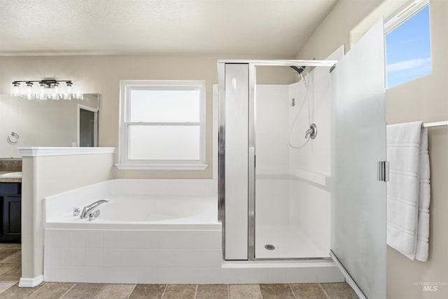 5217 Weston Ave, Caldwell, ID 83607 - bathroom with plenty of natural light, vanity, a stall shower, and a bath