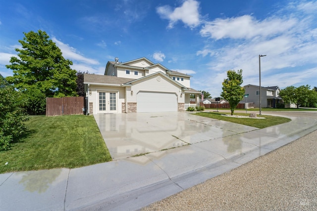 5217 Weston Ave, Caldwell, ID 83607 - traditional home featuring concrete driveway, an attached garage, and french doors