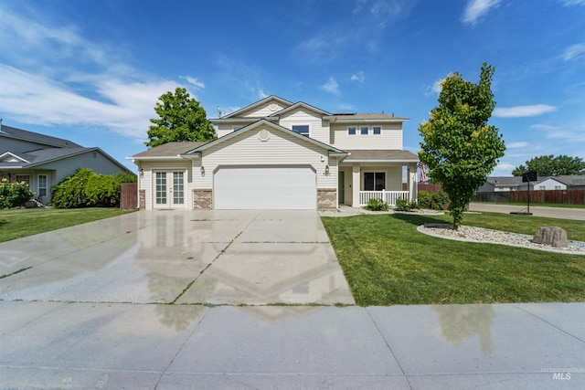 5217 Weston Ave, Caldwell, ID 83607 - traditional-style house featuring roof mounted solar panels, an attached garage, covered porch, driveway, and brick siding
