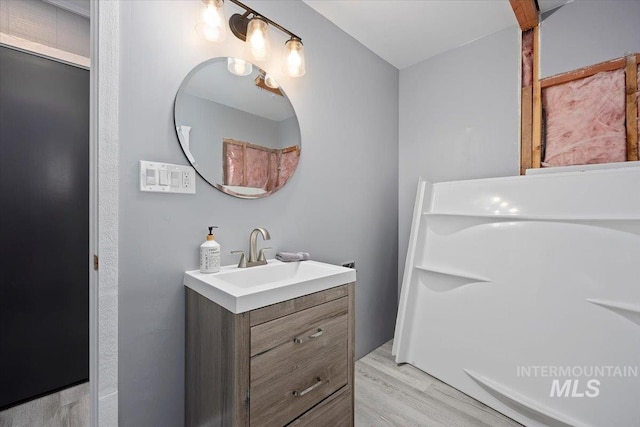 bathroom with vanity and hardwood / wood-style floors