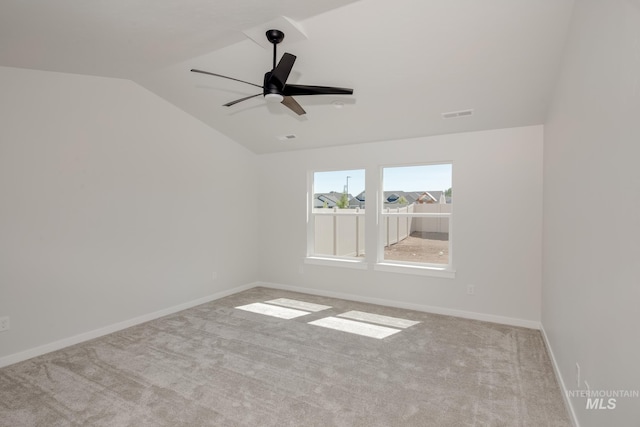 8172 E Red Horse St, Nampa, ID 83687 - carpeted spare room with vaulted ceiling, a ceiling fan, and baseboards