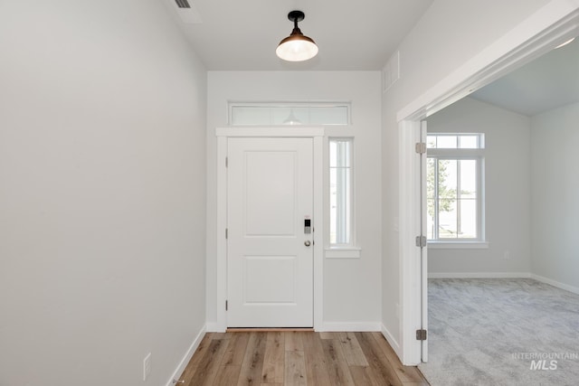 8172 E Red Horse St, Nampa, ID 83687 - foyer with baseboards and light wood-style flooring