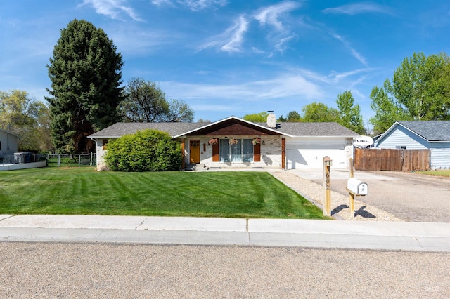 602 Fletcher Dr, Nampa, ID 83686 - single story home with concrete driveway, an attached garage, and a chimney