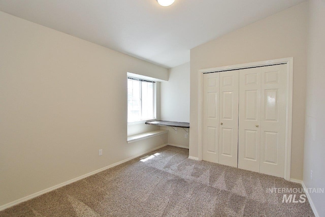 1300 Diamond Ct, Nampa, ID 83686 - unfurnished bedroom with carpet floors, a closet, baseboards, and vaulted ceiling