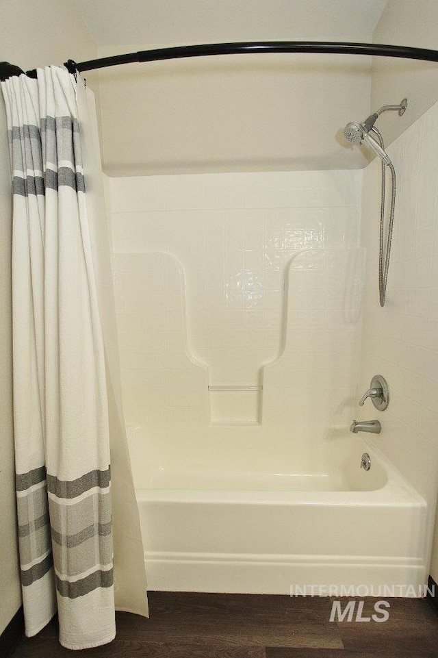1300 Diamond Ct, Nampa, ID 83686 - bathroom featuring shower / bath combination with curtain and wood finished floors