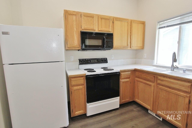 1300 Diamond Ct, Nampa, ID 83686 - kitchen with freestanding refrigerator, electric range, black microwave, a sink, and light countertops