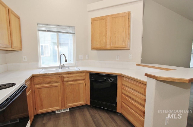 1300 Diamond Ct, Nampa, ID 83686 - kitchen featuring black dishwasher, a sink, a peninsula, and light countertops