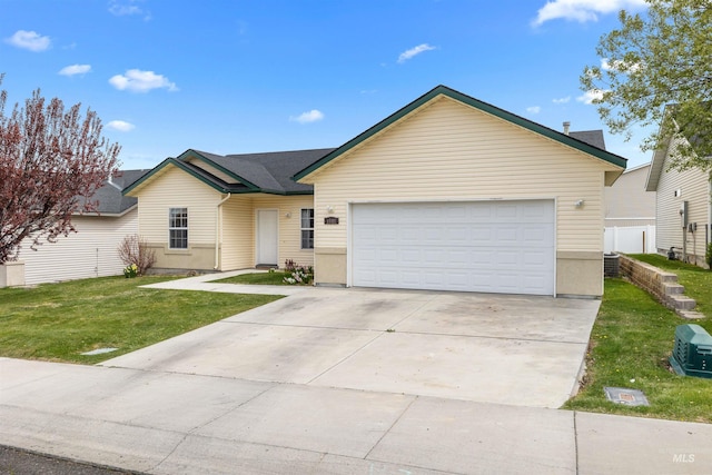 1597 Vista Dr, Twin Falls, ID 83301 - single story home featuring a garage, concrete driveway, and a front lawn