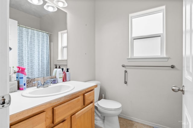 1597 Vista Dr, Twin Falls, ID 83301 - full bathroom with vanity, tile patterned floors, toilet, and a shower with shower curtain