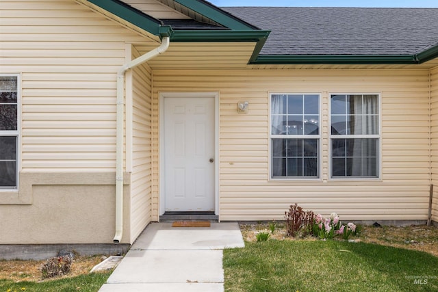 1597 Vista Dr, Twin Falls, ID 83301 - property entrance with a lawn and a shingled roof