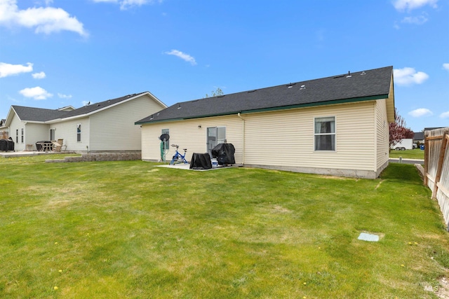 1597 Vista Dr, Twin Falls, ID 83301 - rear view of property with a lawn, fence, and a patio area