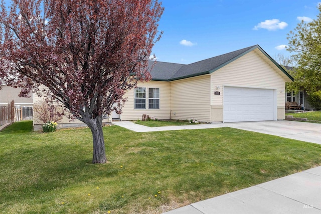 1597 Vista Dr, Twin Falls, ID 83301 - view of front of home featuring a garage, fence, concrete driveway, and a front lawn