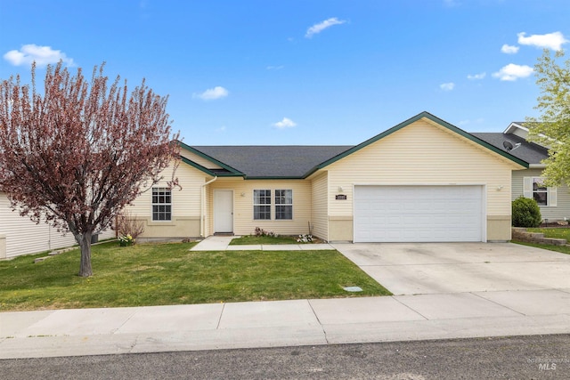 1597 Vista Dr, Twin Falls, ID 83301 - single story home featuring a garage, a front lawn, and concrete driveway
