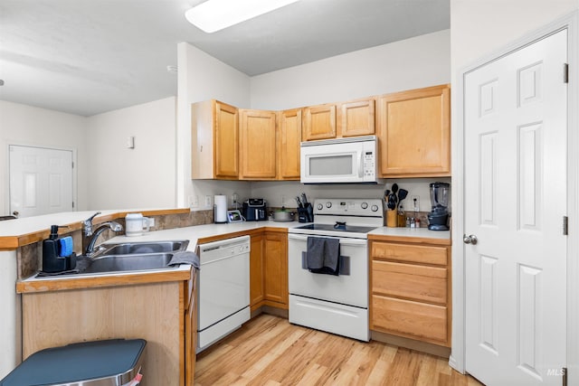 1597 Vista Dr, Twin Falls, ID 83301 - kitchen with white appliances, a peninsula, light wood-type flooring, and light brown cabinets