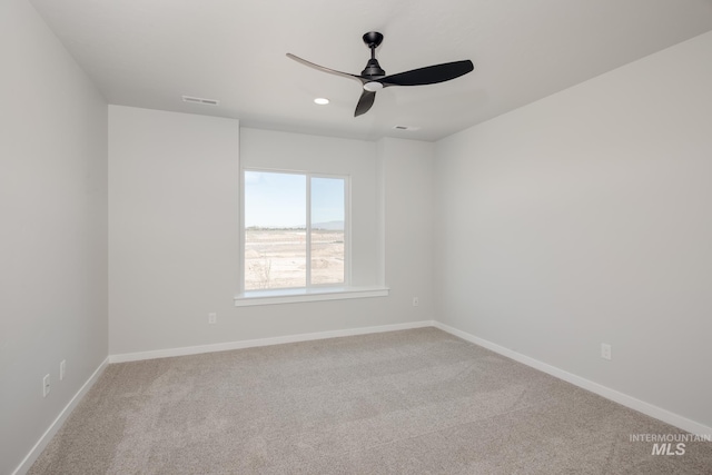 carpeted empty room with ceiling fan