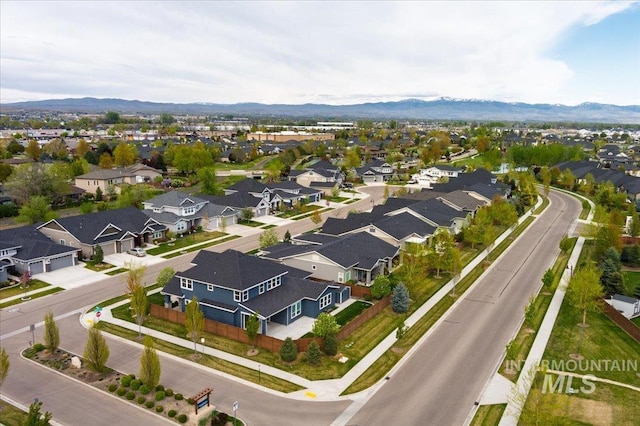 drone / aerial view featuring a mountain view and a residential view