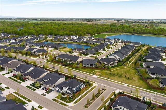 aerial view with a residential view and a water view