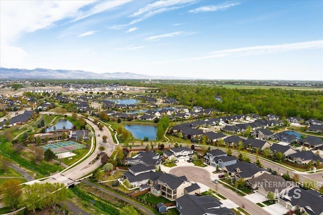 bird's eye view with a water and mountain view and a residential view