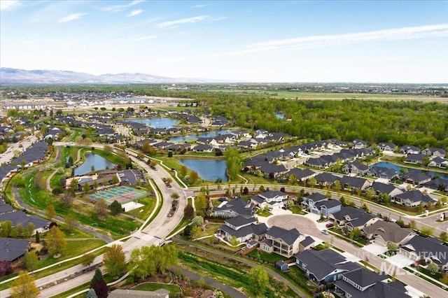 bird's eye view featuring a residential view and a water and mountain view