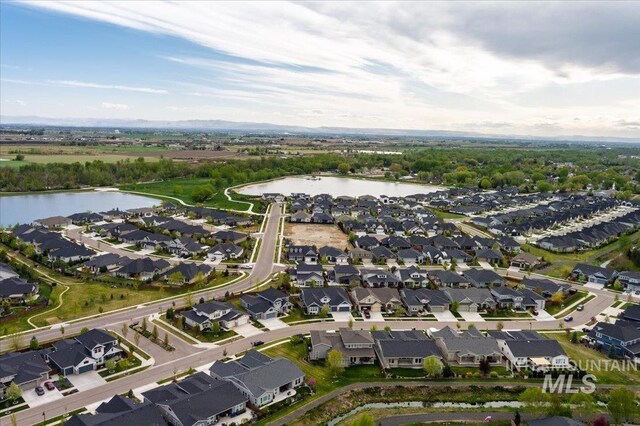 birds eye view of property with a residential view and a water view