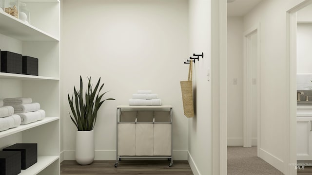 details featuring wood finished floors and baseboards