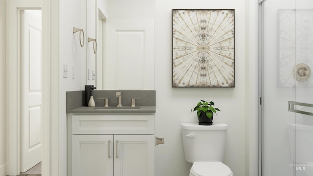 bathroom featuring an enclosed shower, toilet, and vanity