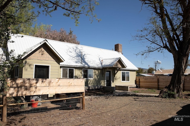 85 E Central Blvd, Cambridge, ID 83610 - view of front of house featuring fence, a chimney, and metal roof