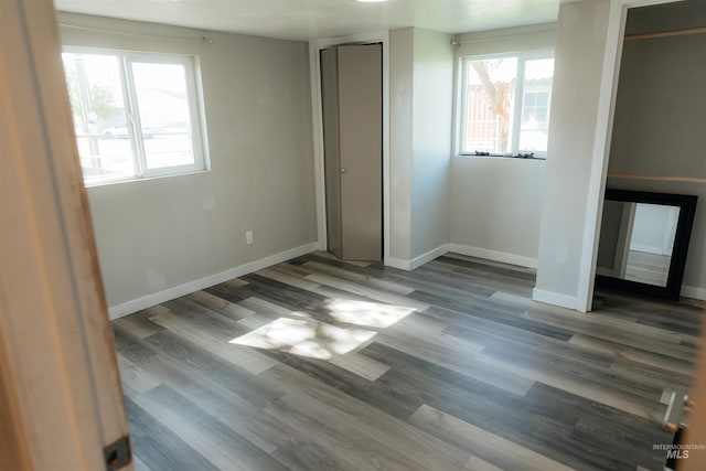 85 E Central Blvd, Cambridge, ID 83610 - unfurnished bedroom featuring multiple windows, baseboards, and wood finished floors