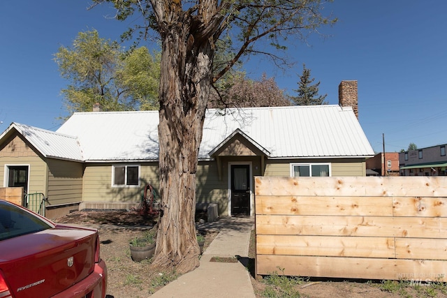 85 E Central Blvd, Cambridge, ID 83610 - view of front of house featuring metal roof, fence, and a chimney