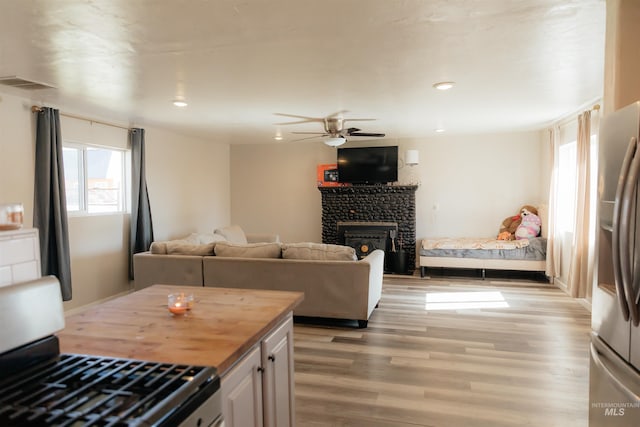 85 E Central Blvd, Cambridge, ID 83610 - living area with light wood-style flooring, ceiling fan, a fireplace, and recessed lighting