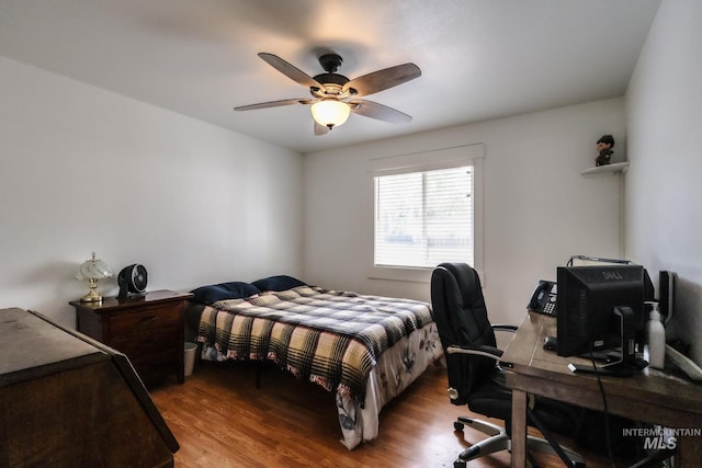bedroom with ceiling fan and wood finished floors