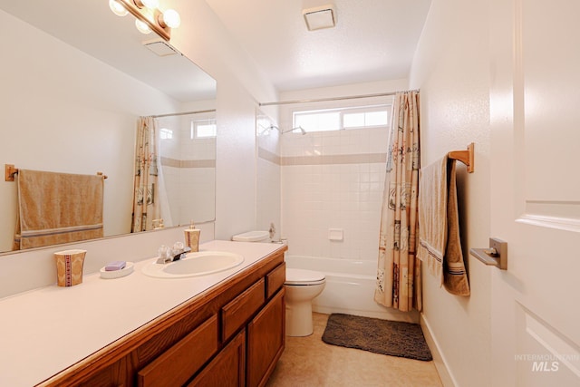 full bath featuring vanity, shower / bath combo, toilet, and visible vents