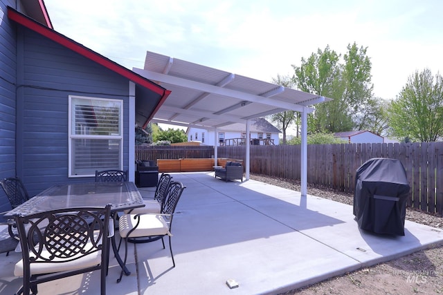 view of patio with a fenced backyard and outdoor dining area