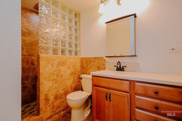 full bath featuring a walk in shower, toilet, tile walls, and vanity