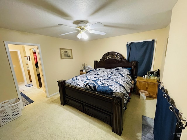 bedroom featuring light carpet and ceiling fan