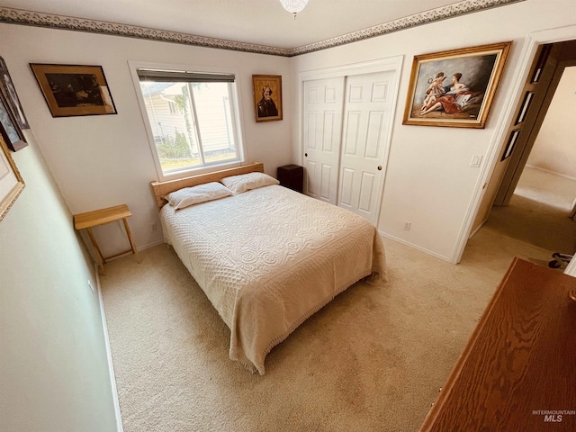 carpeted bedroom with a closet