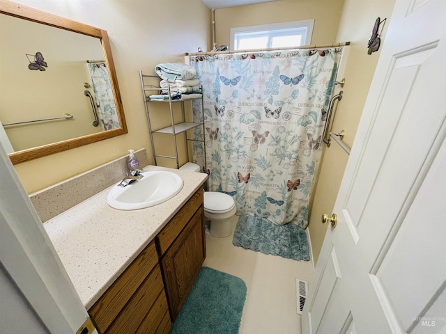 bathroom featuring vanity, toilet, and a shower with shower curtain