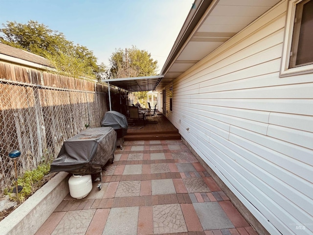 view of patio / terrace featuring grilling area and a deck