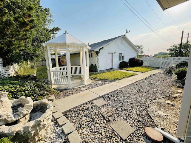 exterior space featuring a gazebo and a front yard