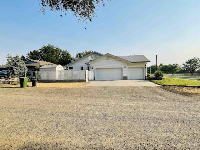 single story home featuring a garage and a front lawn