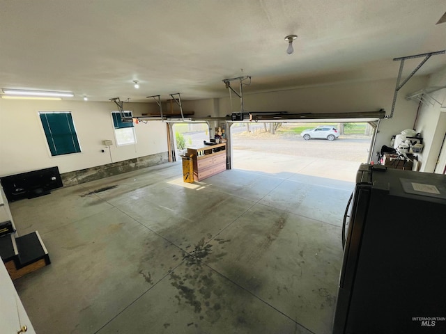 garage featuring black fridge