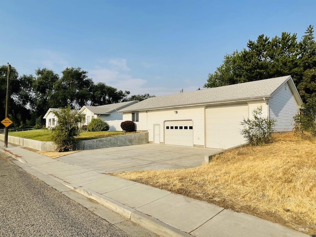 ranch-style house featuring a garage