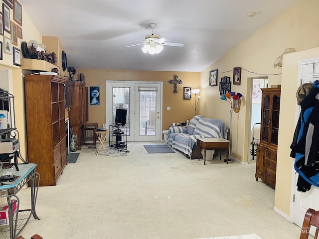 carpeted bedroom featuring access to exterior and ceiling fan